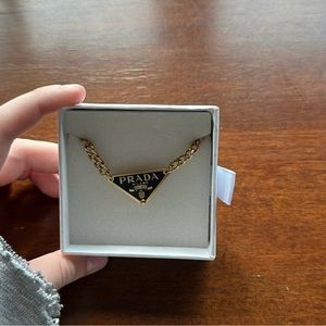 authentic prada necklace in black and gold